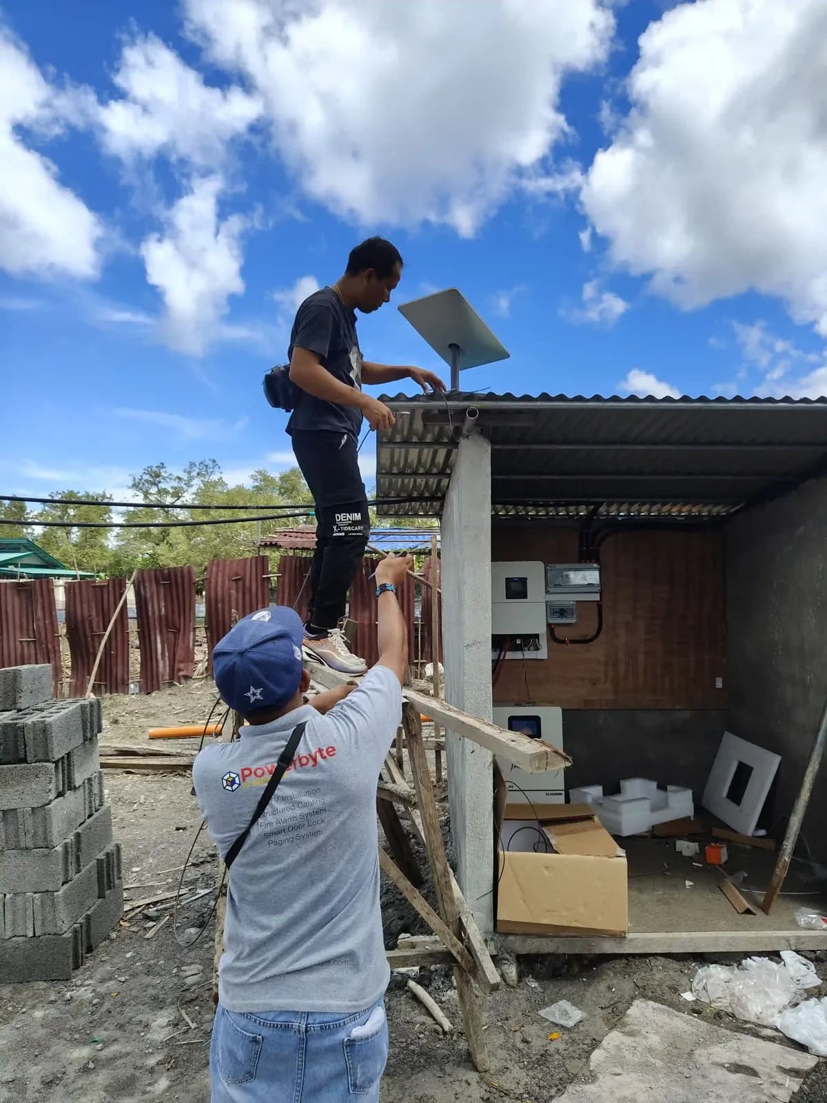 Powerbyte technicians on a job, mid-installation.