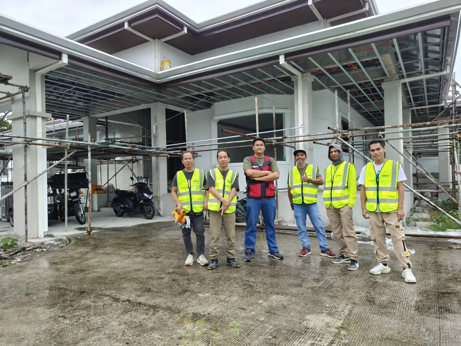 The Powerbyte crew lined up in hi-vis safety vests at a fit-out site.