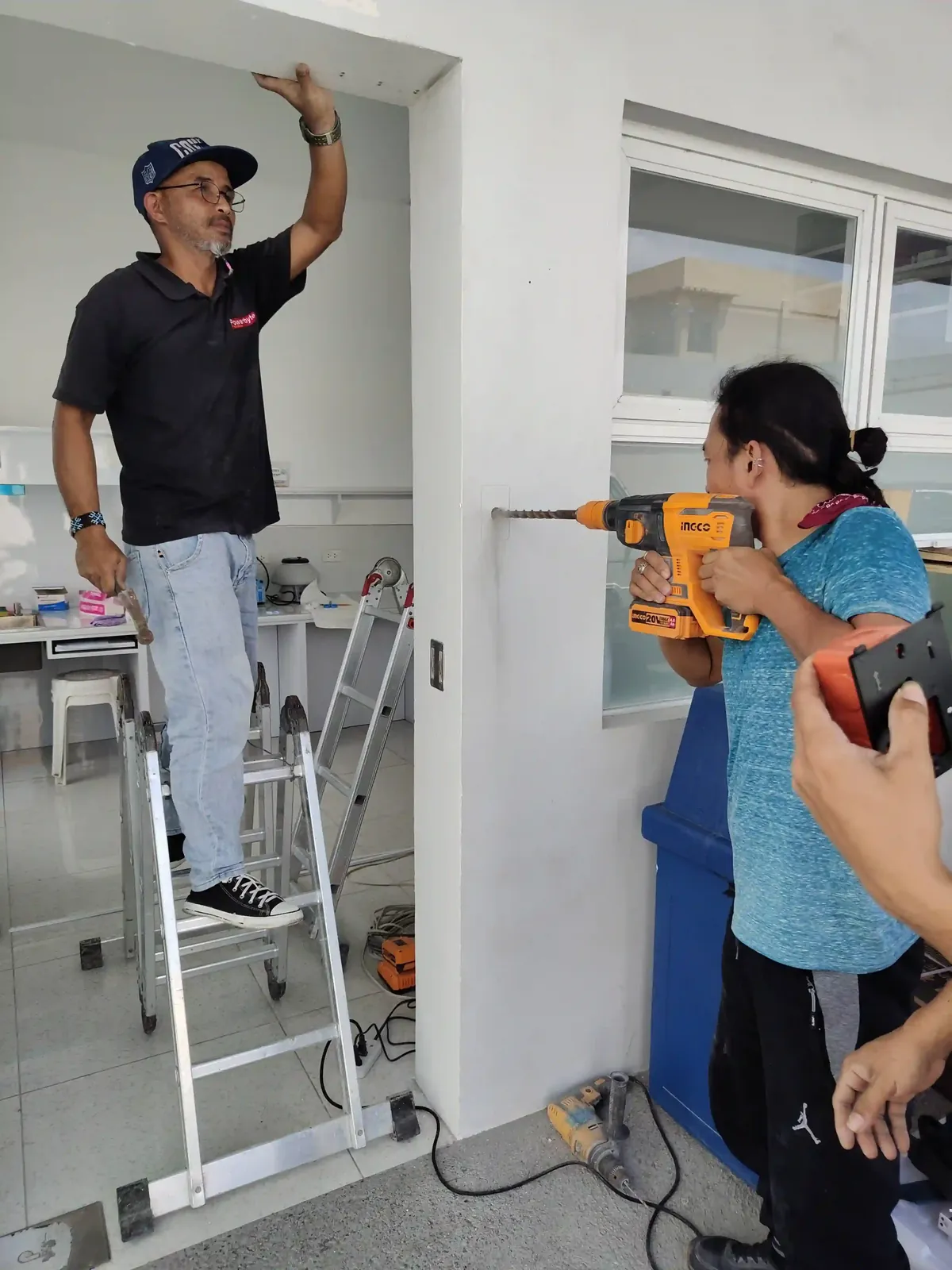 Candid on-site photo of the Powerbyte team at work.