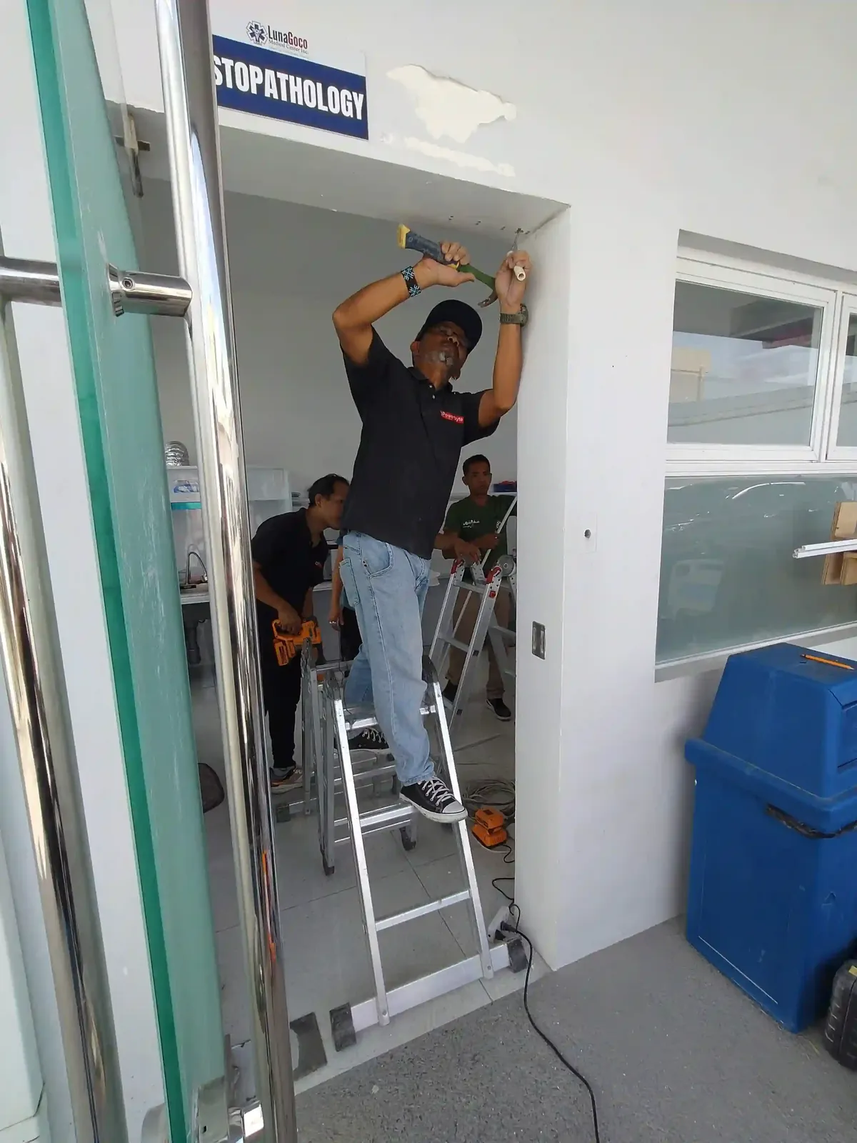 Powerbyte technicians on a job, mid-installation.